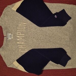 Champion sweat shirt. Large sleeves are fleece . Grey body. Dark blue sleeves.